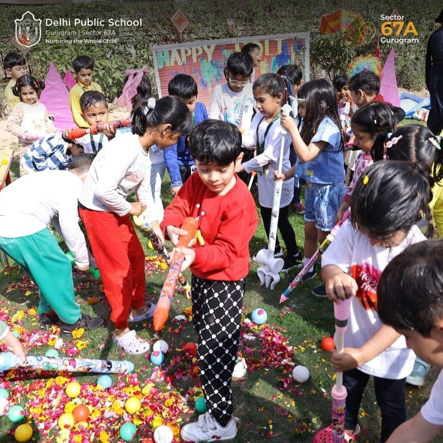 Young children celebrating a festival with colours and play at school
