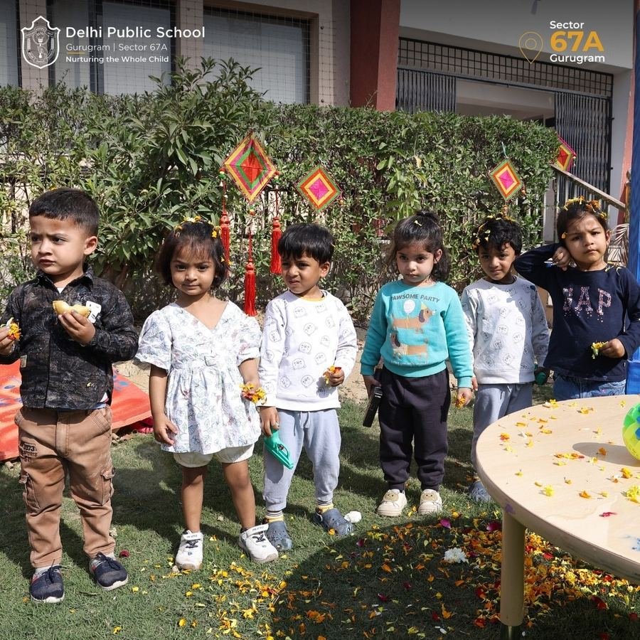 Pre-Nursery children enjoying outdoor play on the DPS Gurugram lawn